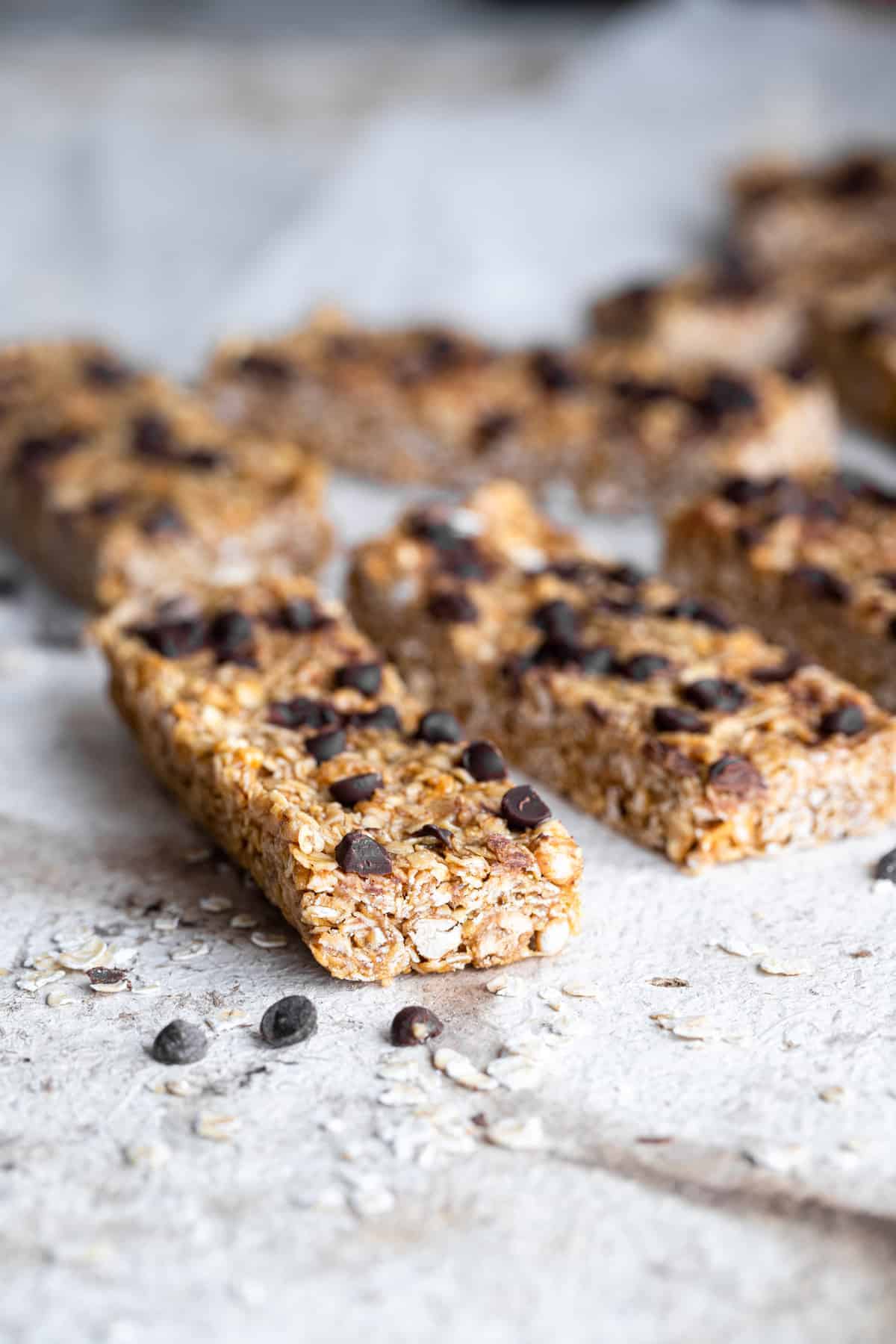 healthy chewy granola bars in a line on a table