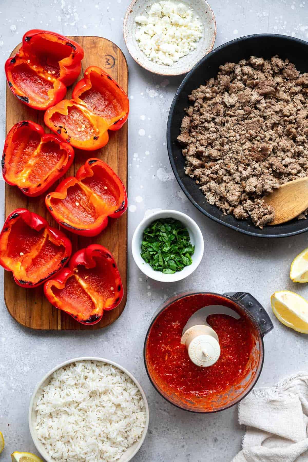 ingredients to make grilled stuffed bell peppers on a table