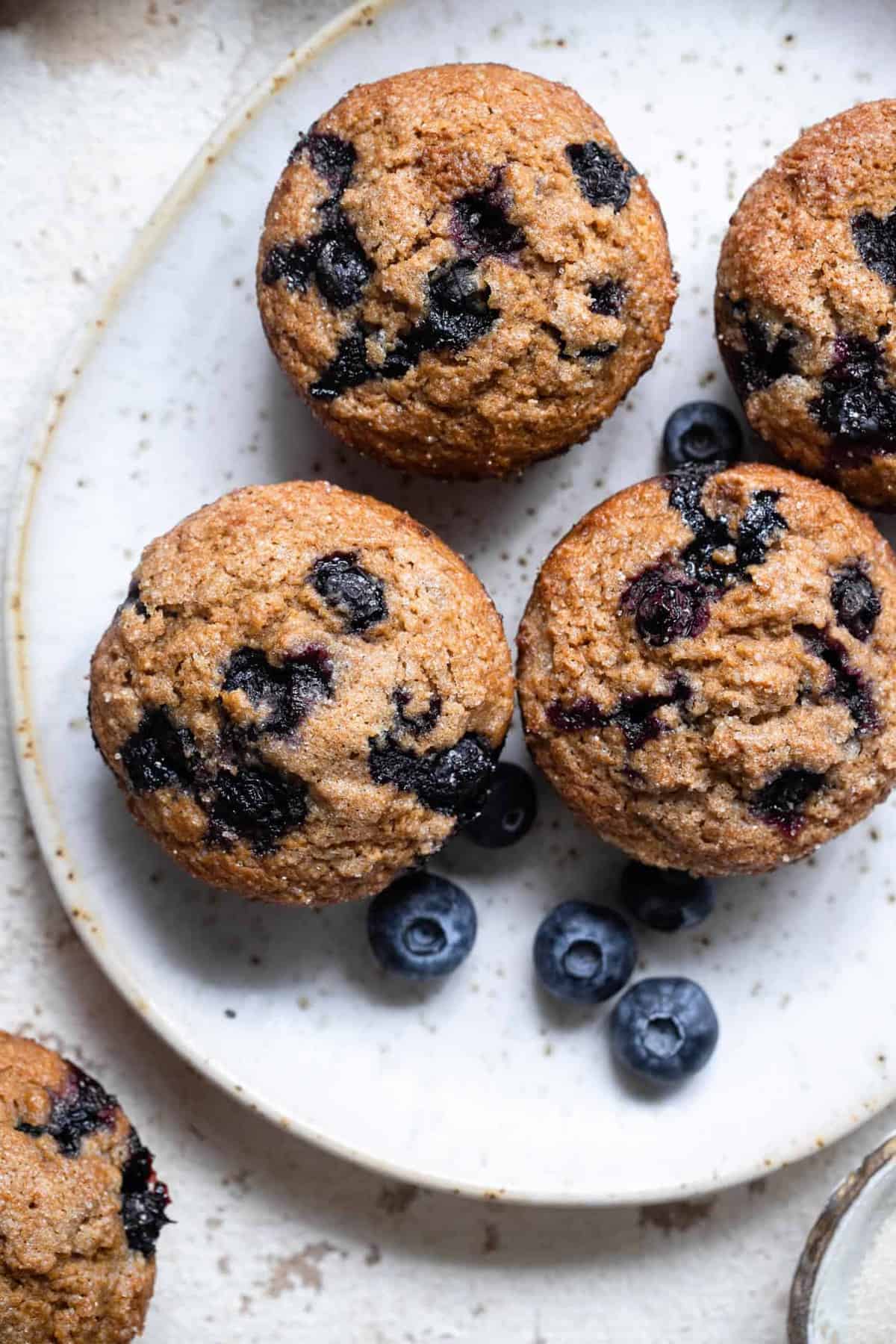 A whole wheat blueberry muffins recipe on a plate
