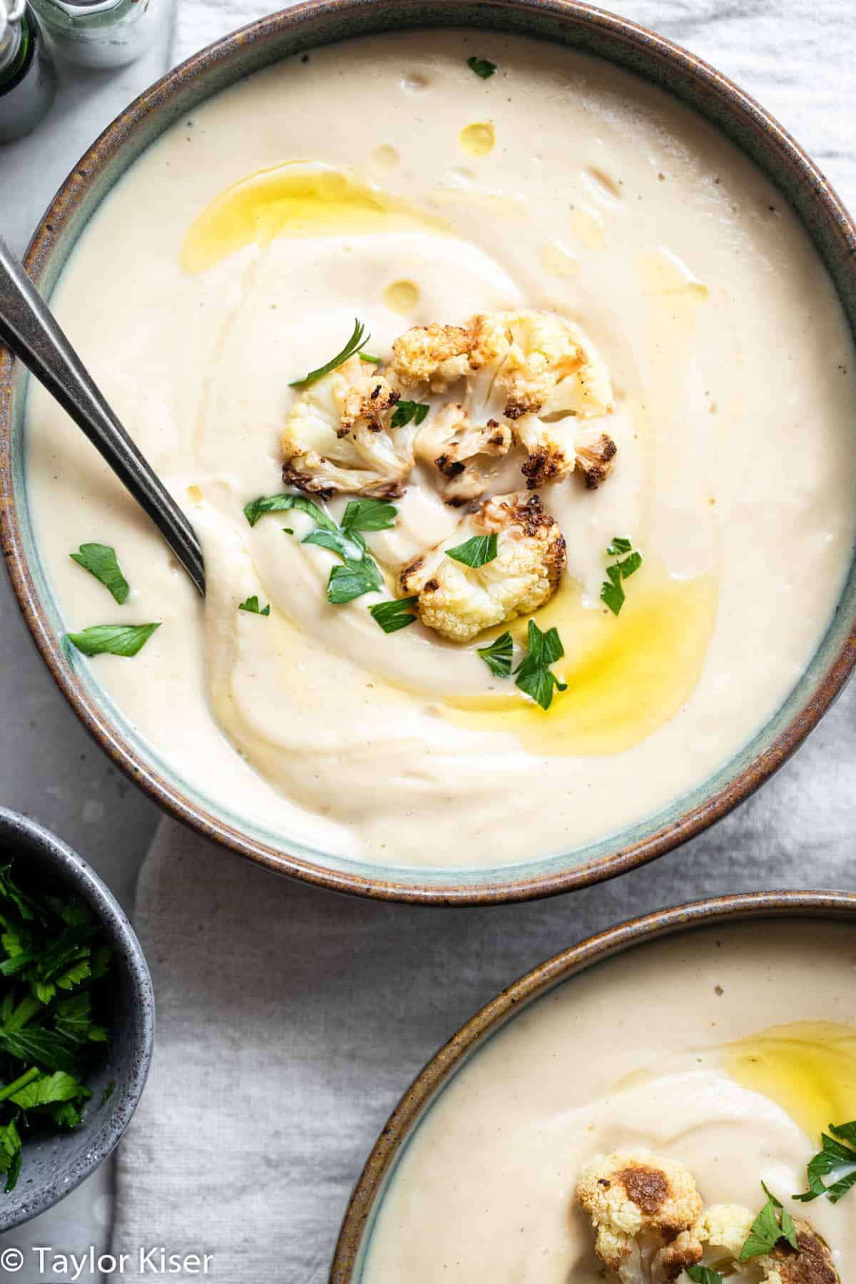 close up of vegan cauliflower soup in a bowl