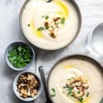 close up of two bowls of low carb cauliflower soup