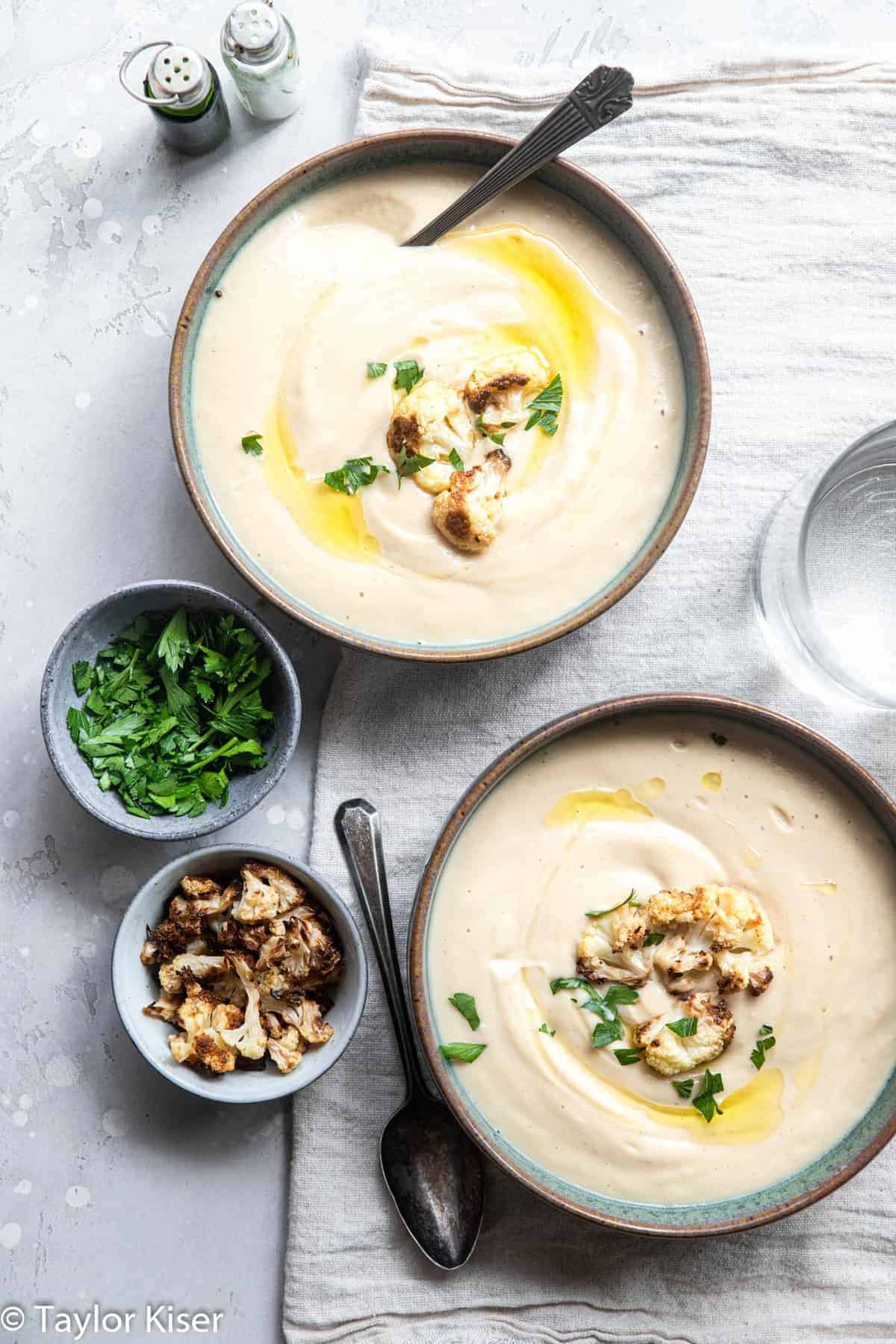 close up of two bowls of low carb cauliflower soup