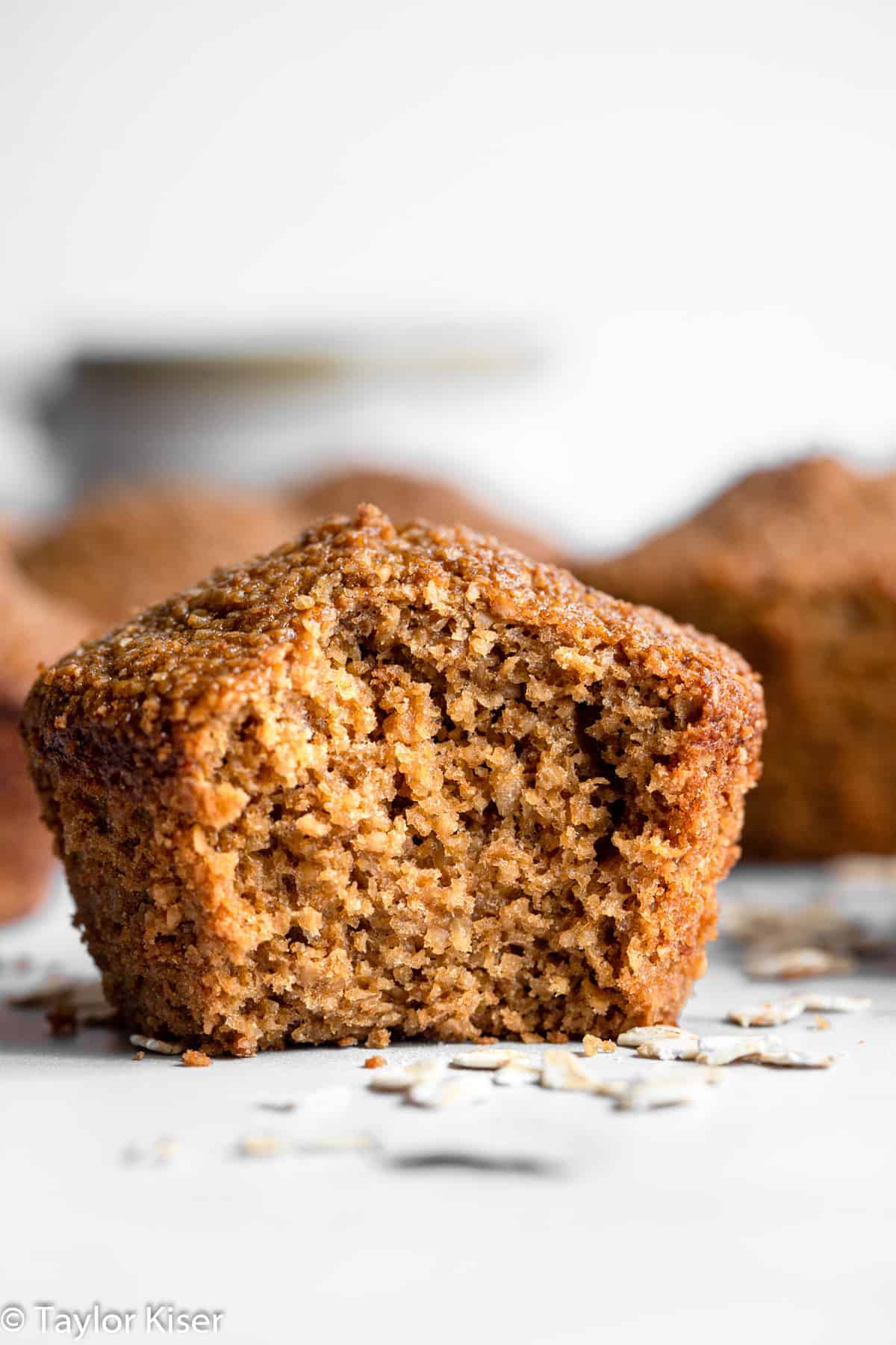 healthy oat bran muffins with a bite taken out of one