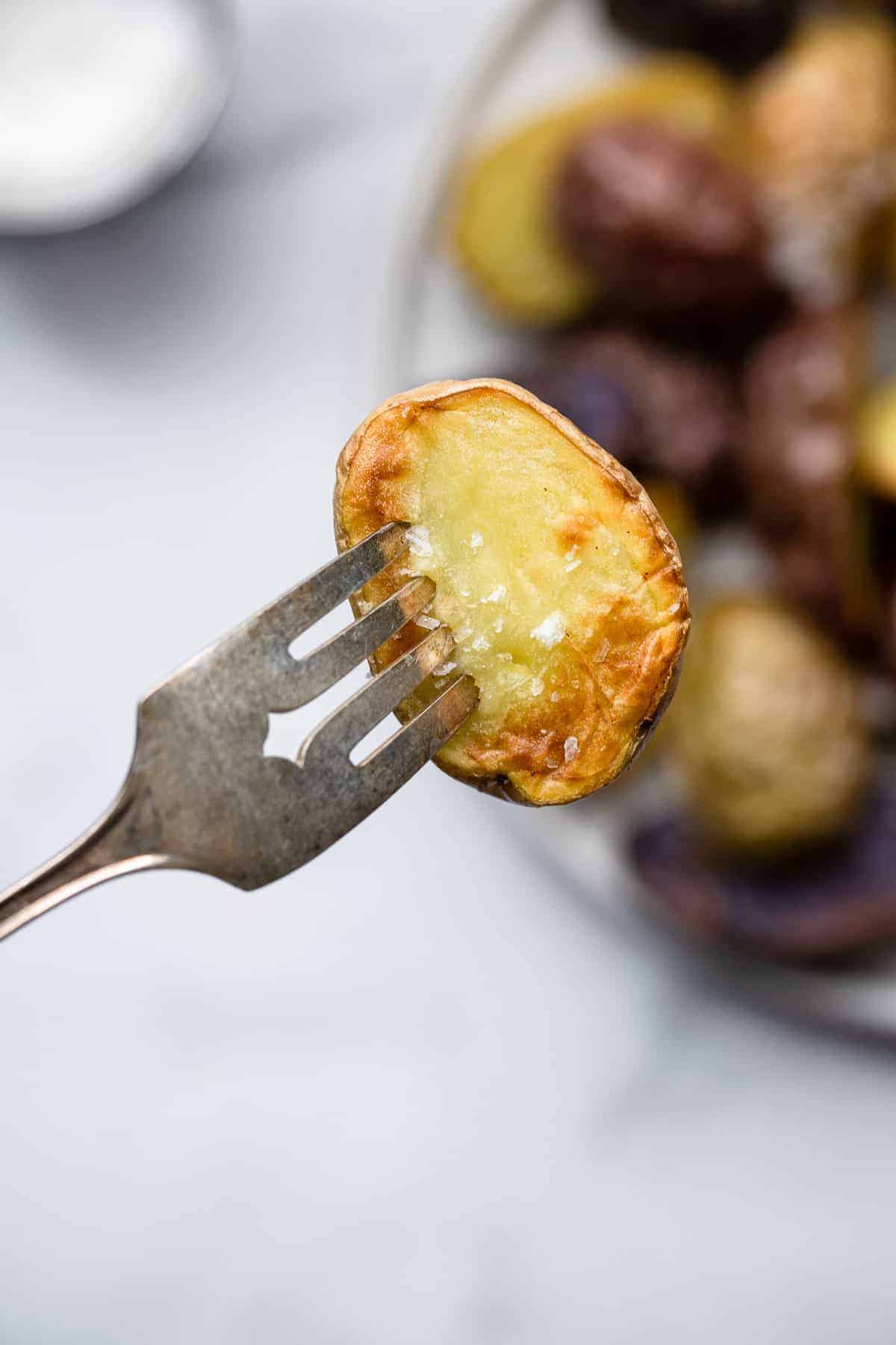 air fryer roasted potatoes on a fork
