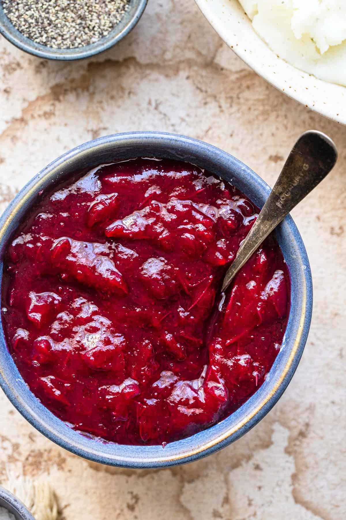 Low carb cranberry sauce in a blue bowl