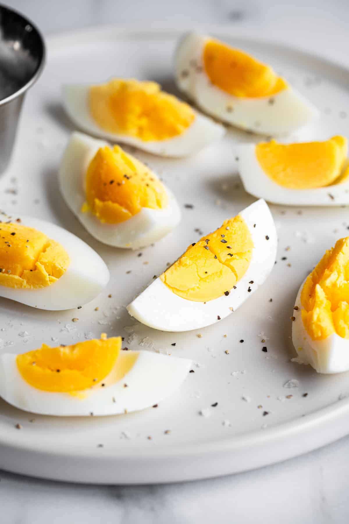 sliced ​​air fryer hard boiled eggs with pepper on top
