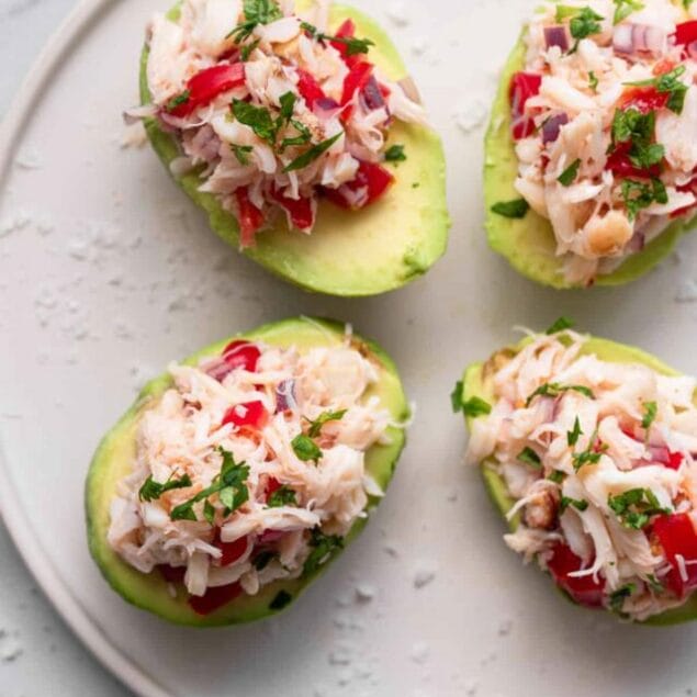 top view of crab avocado salad on a plate with cilantro