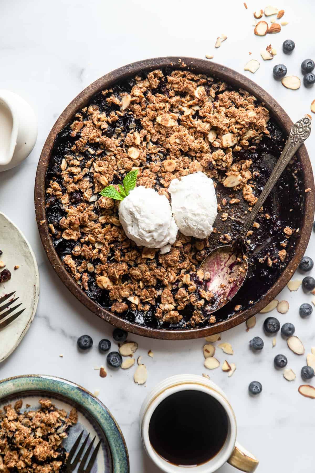 Gluten Free Blueberry Crisp in a bowl with a spoon