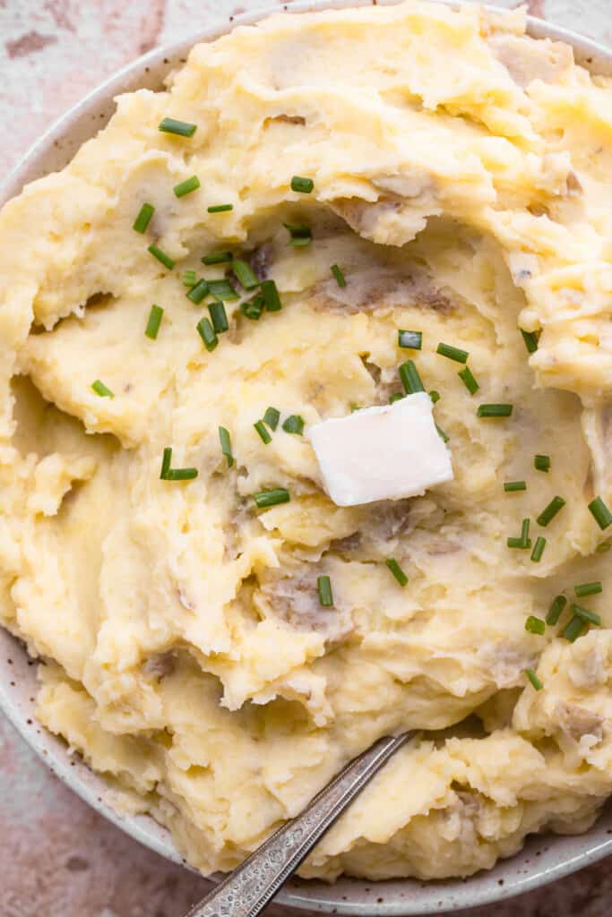close up view of Whole30 Mashed Potatoes with butter on top
