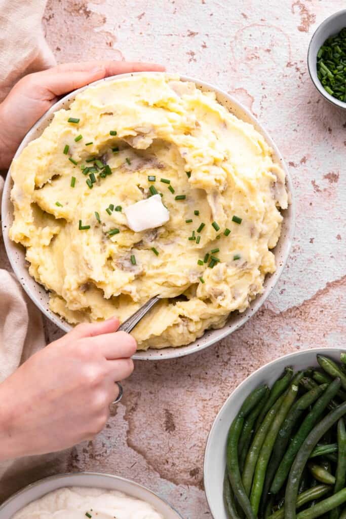 Whole30 Mashed Potatoes in a large bowl being served
