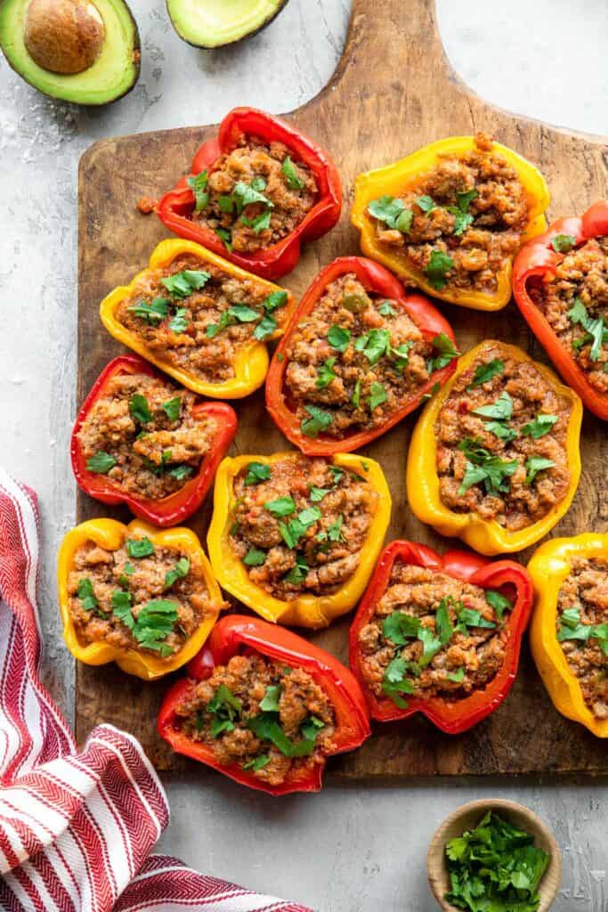 Whole30 Stuffed Peppers arranged on a large cutting board