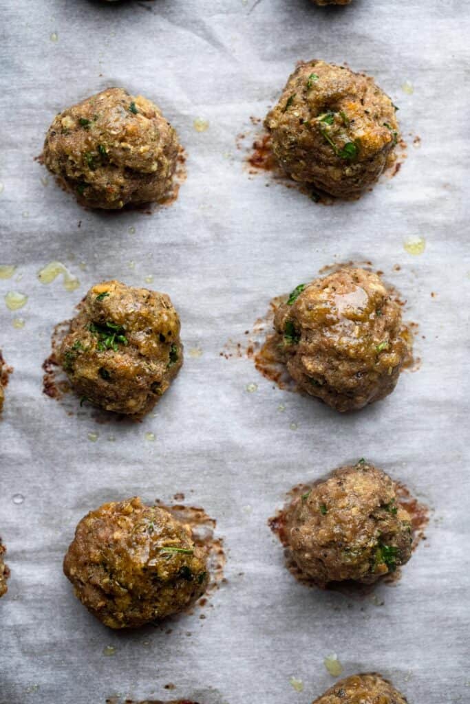 Healthy Turkey Meatballs on a baking sheet ready to be cooked