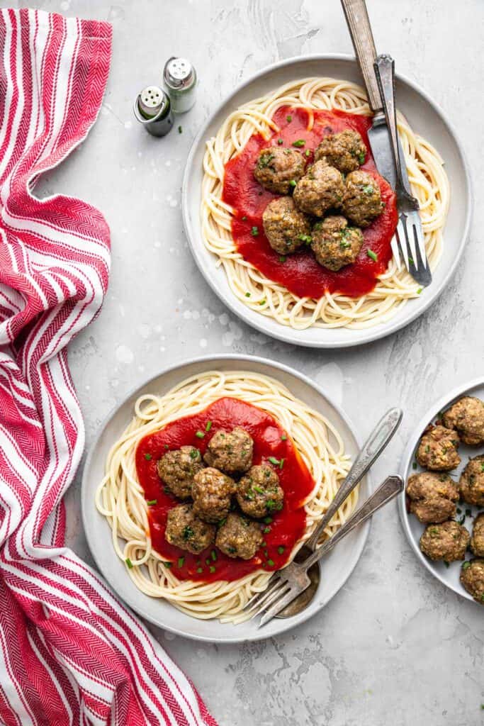 Healthy Turkey Meatballs in 2 bowls of spaghetti