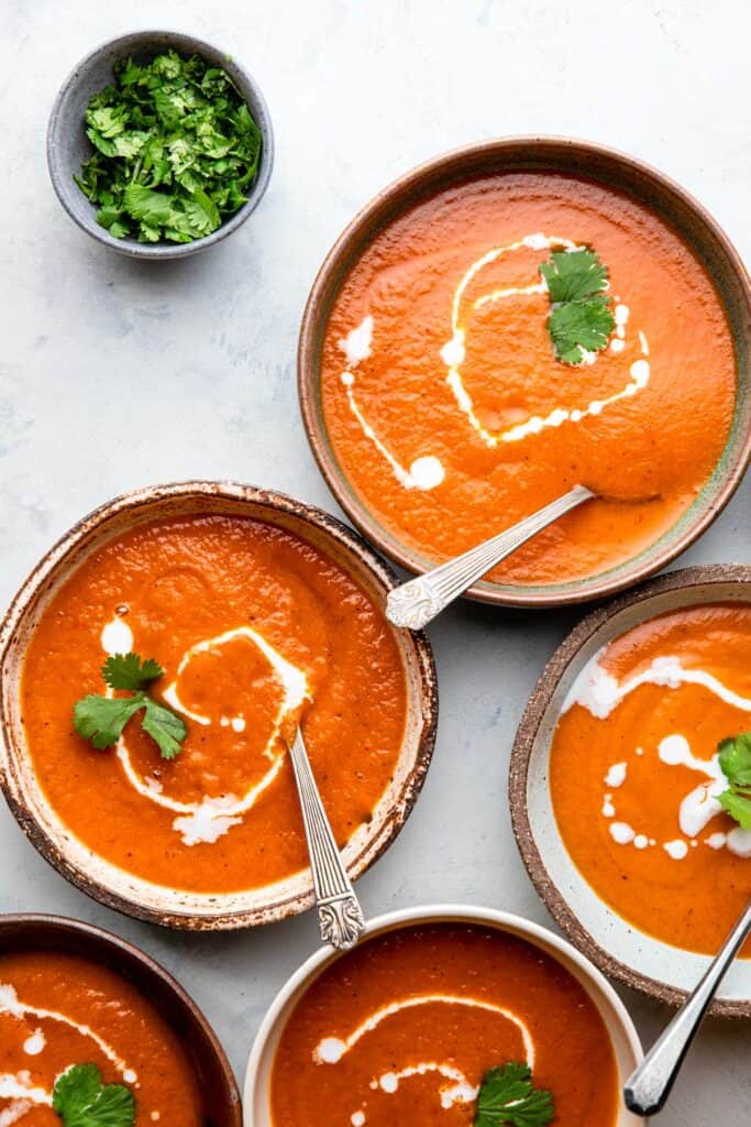 several bowls of Instant Pot Southwestern Sweet Potato Soup on a table