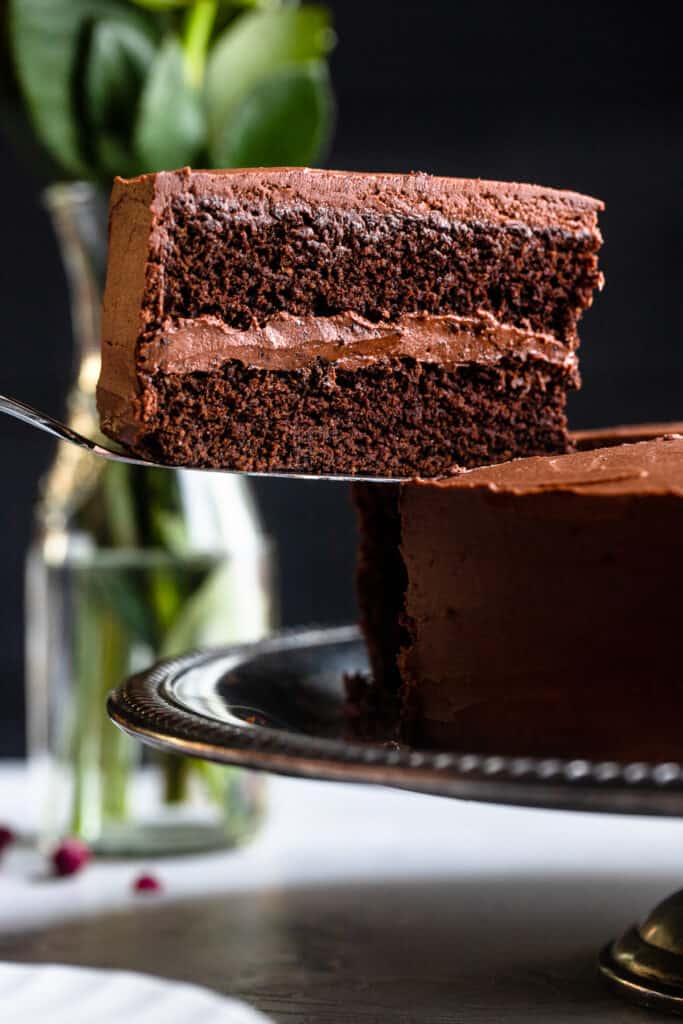 one slice of Keto Chocolate Cake being lifted by a cake server