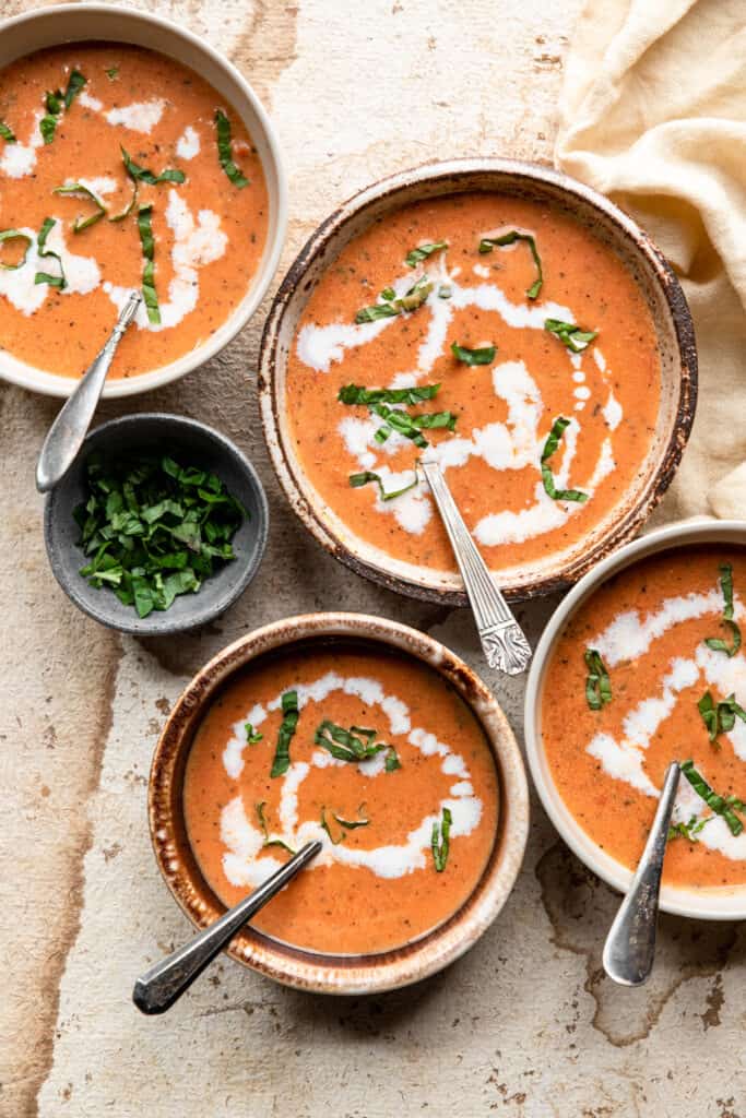 4 bowls of Keto Tomato Soup on a table