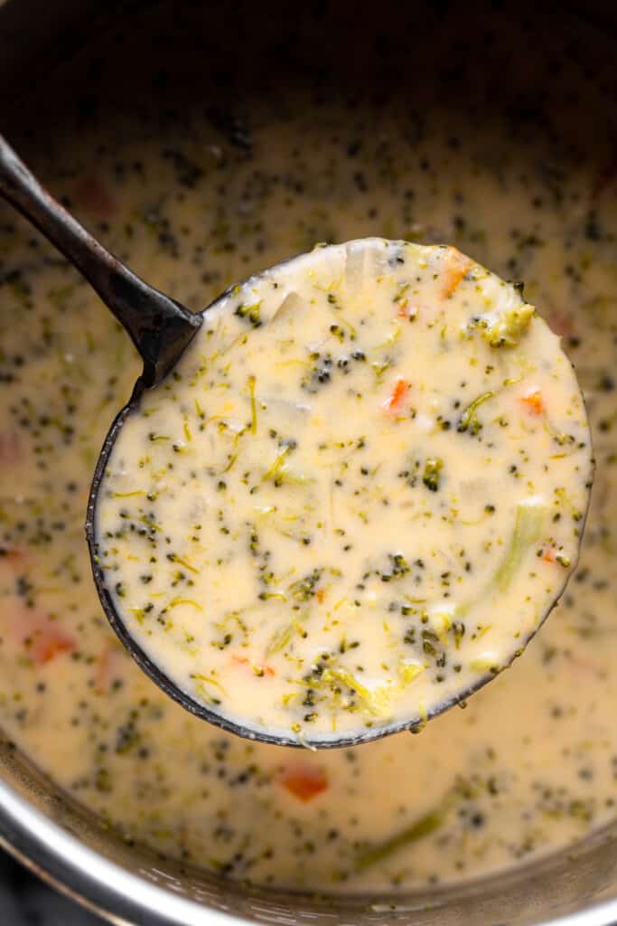 Instant Pot Broccoli Cheddar picked up by a ladle