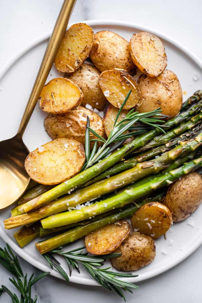 close up view of Roasted Potatoes and Asparagus on a plate