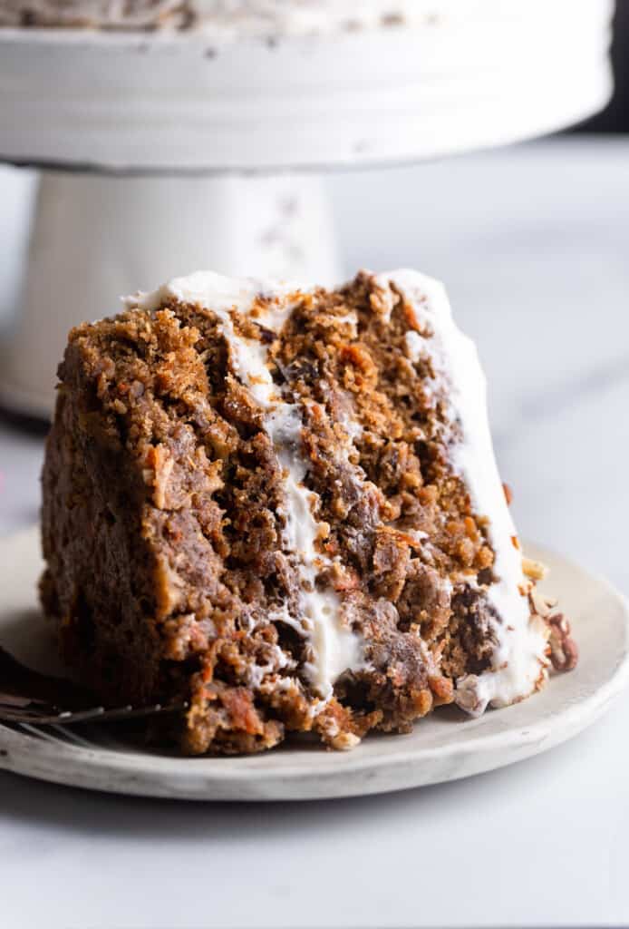 a slice of Vegan Carrot Cake on a small plate