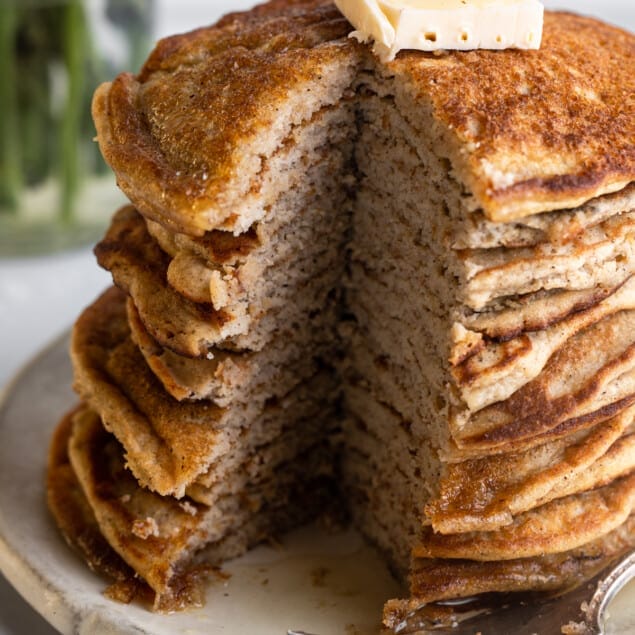 a large stack of Keto Coconut Flour Pancakes on a plate