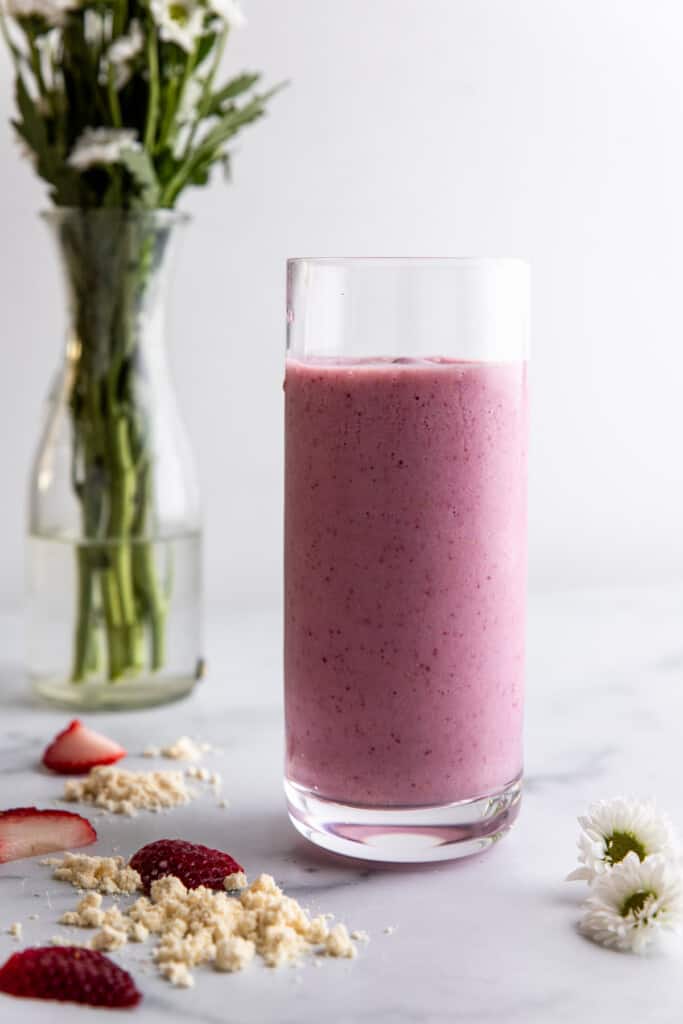 a tall glass filled with Strawberry Protein Shake