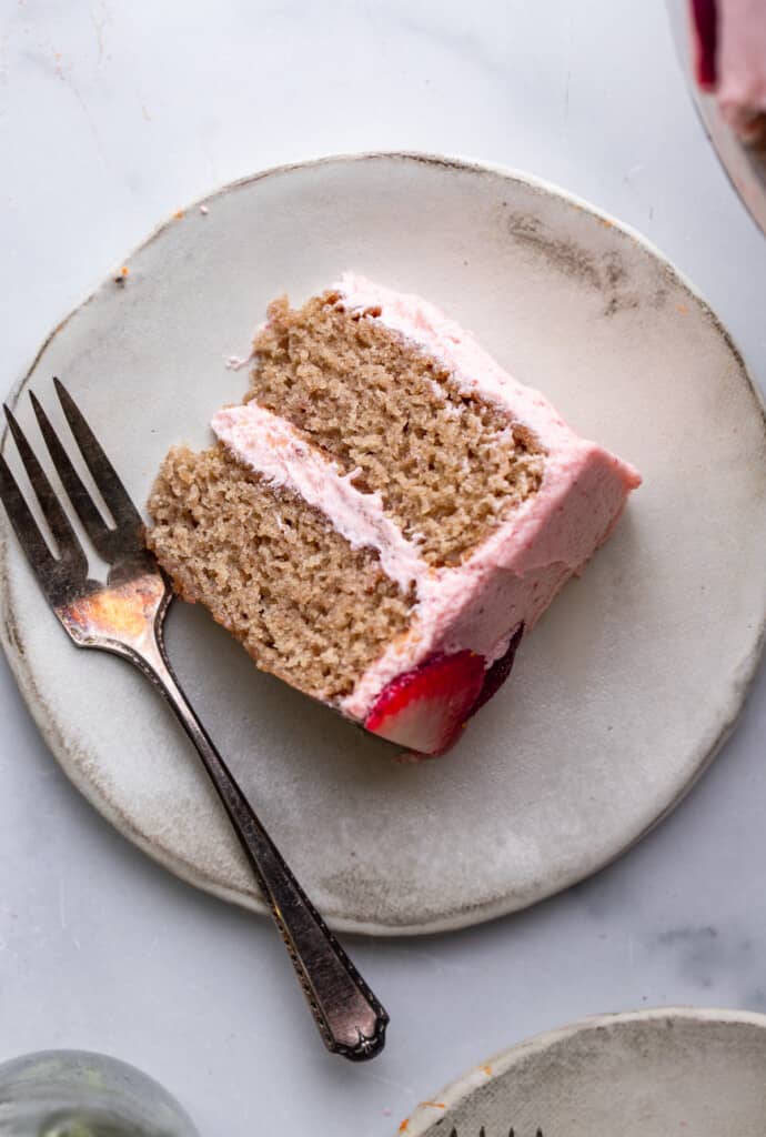 one slice of Vegan Strawberry Cake on a small plate