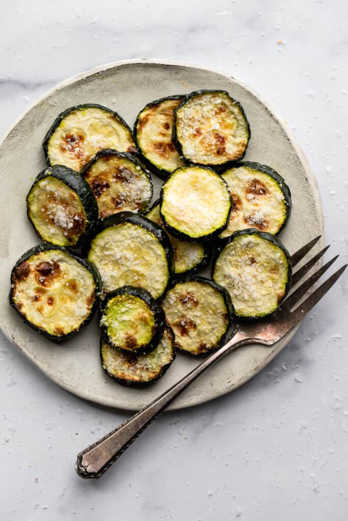 a plat and fork full of Air Fryer Zucchini