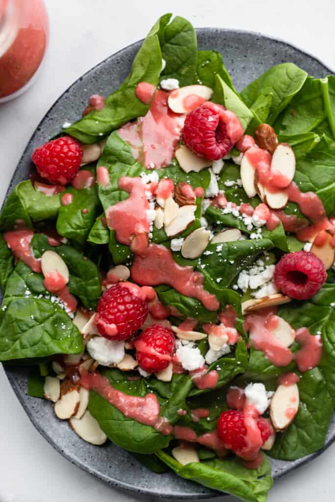 close up of Raspberry Vinaigrette on a salad