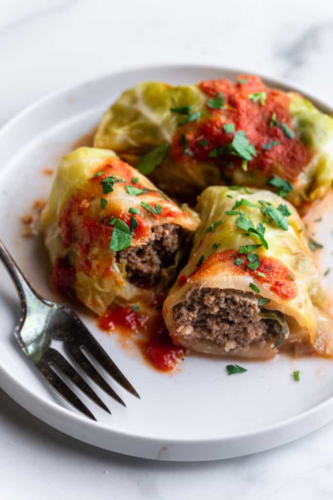 a large Keto Cabbage Roll on a plate with a fork