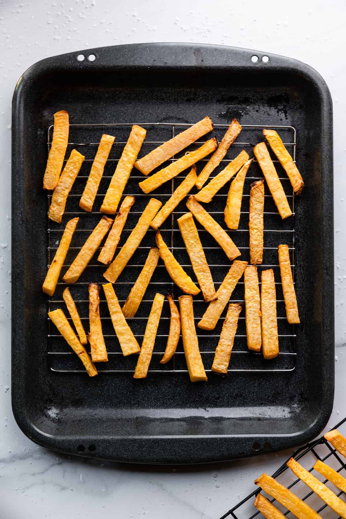 a baking dish full of Keto French Fries