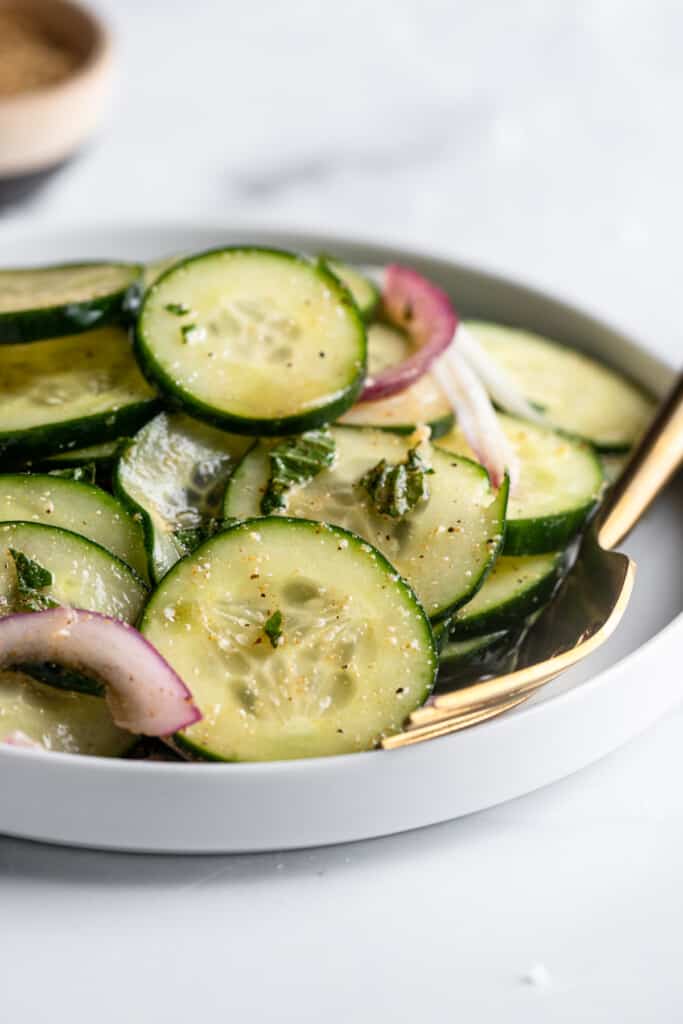 close up view of a Mediterranean Cucumber Salad in a bowl