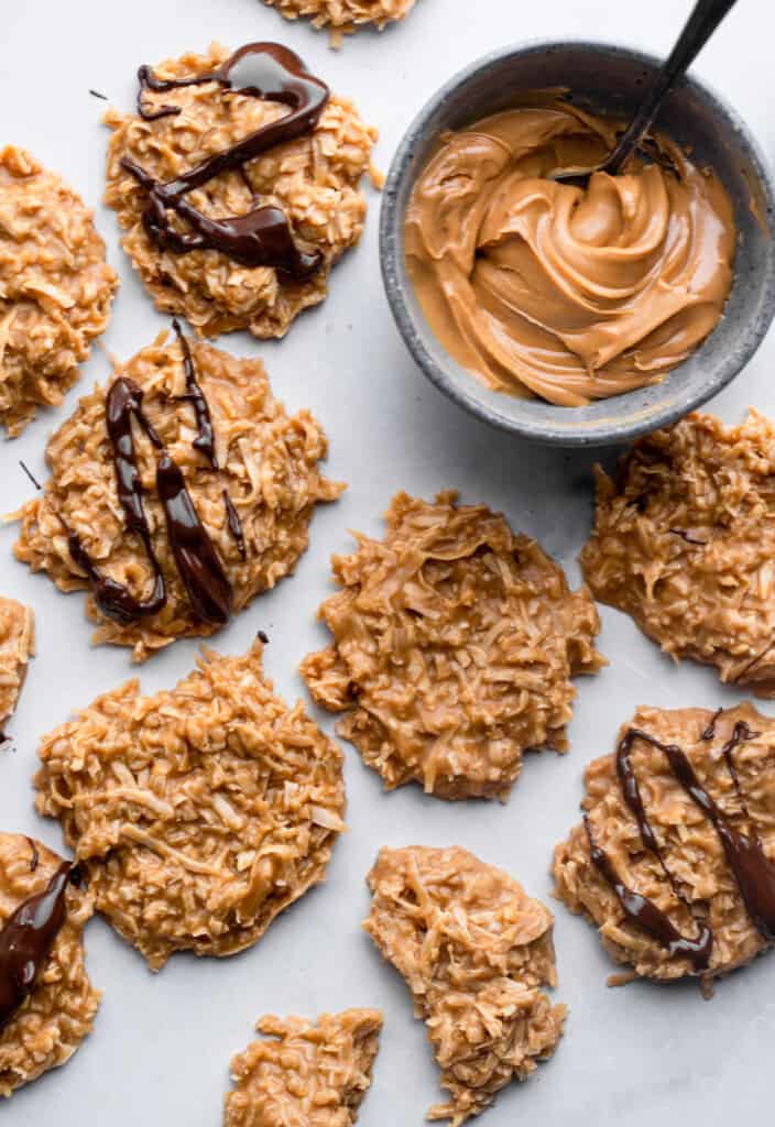 a bunch of Keto No Bake Cookies on a sheet with but butter