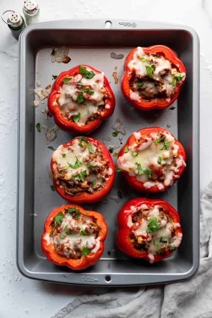 6 Keto Stuffed Peppers arranged in a baking dish