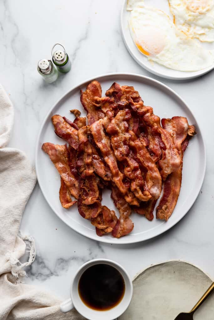 a plate full of cooked air fryer bacon