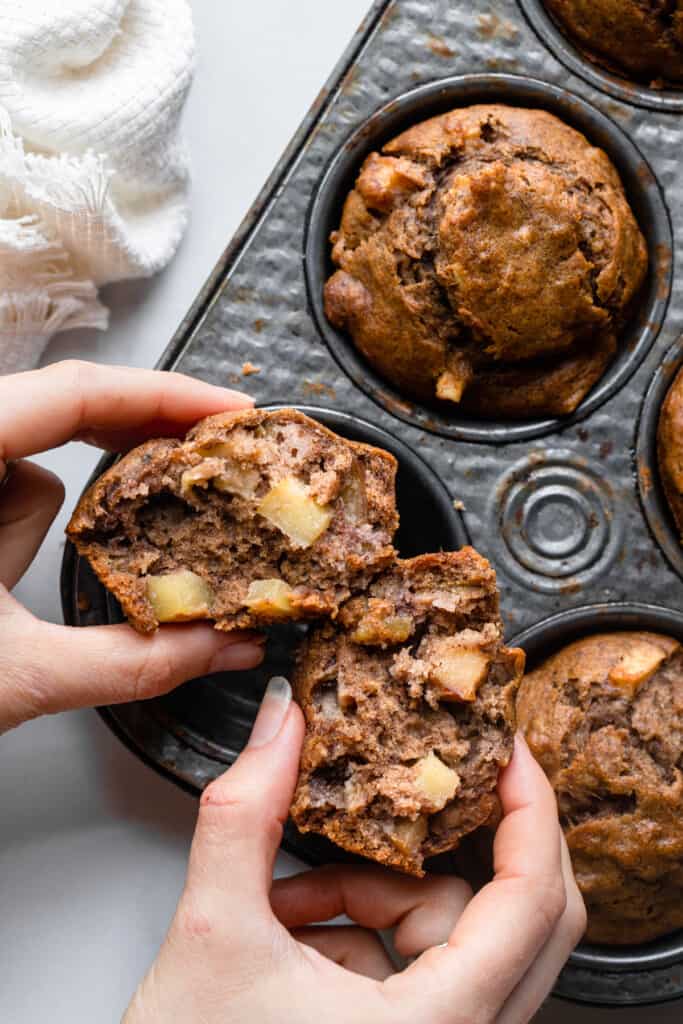 Apple Banana Muffins being torn in half