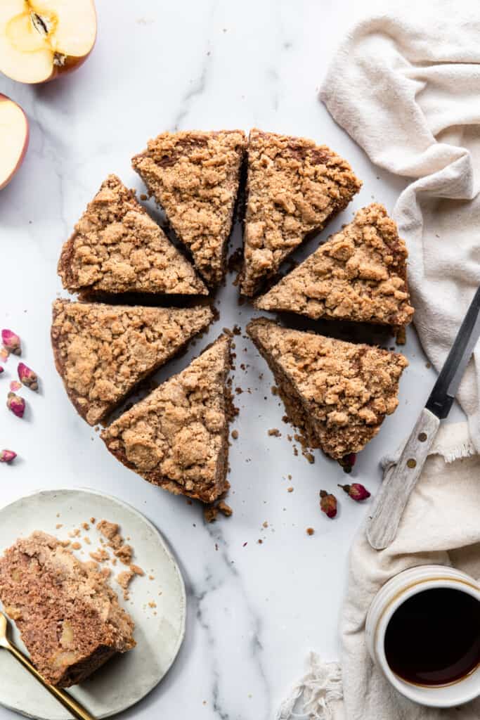 a whole Vegan Apple Cake with a slice missing