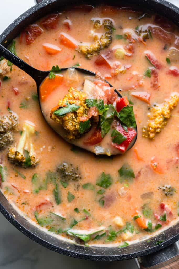 a spoon ladling Coconut Curry Soup