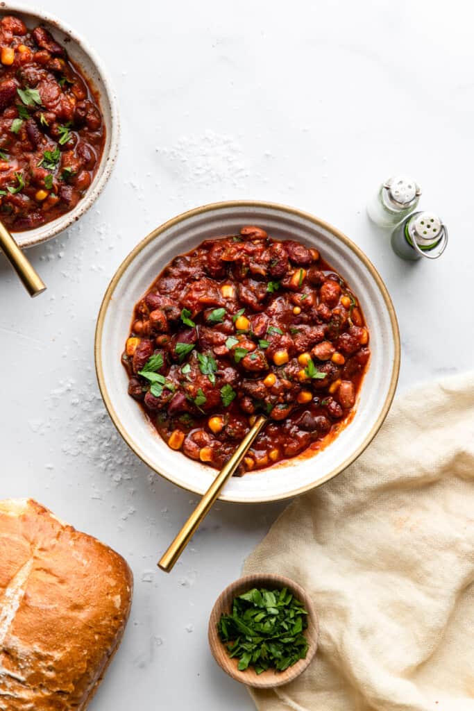 a bowl of Crock Pot Bean Chili on a table with bread