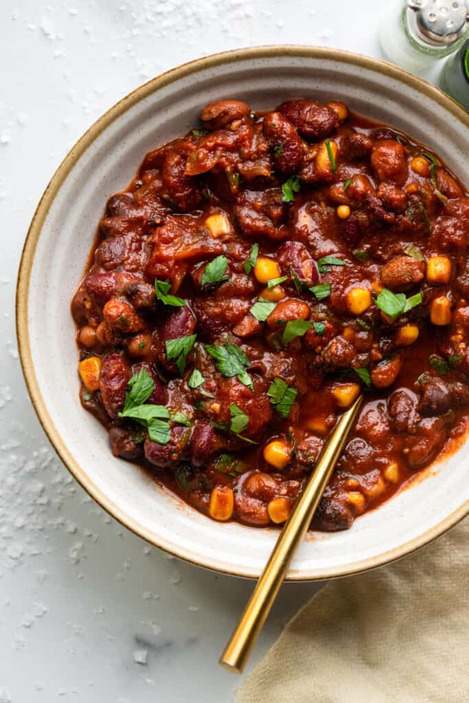 one bowl of Crock Pot Bean Chili with a spoon