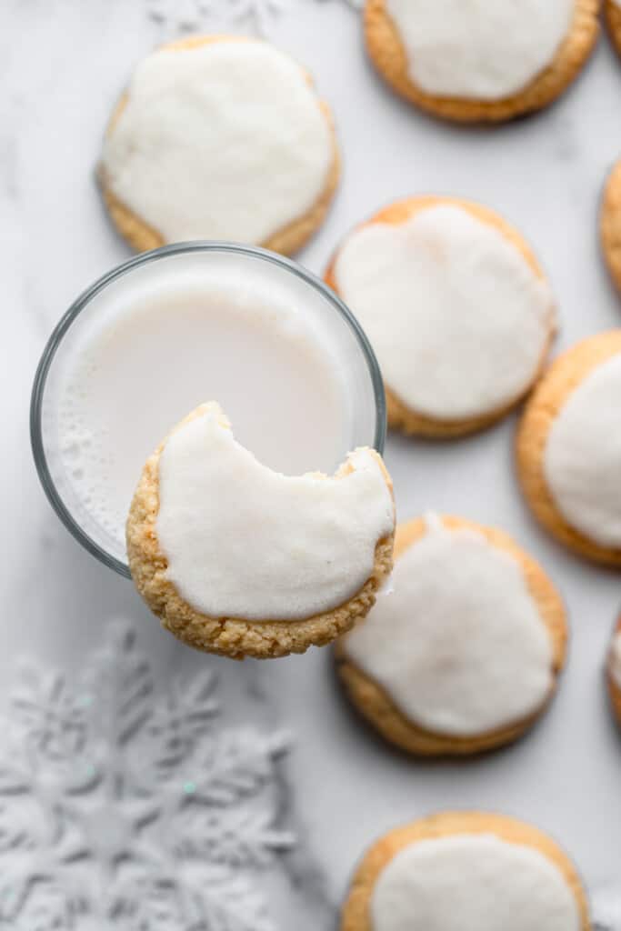 one Almond Flour Sugar Cookies on top of a glass of milk