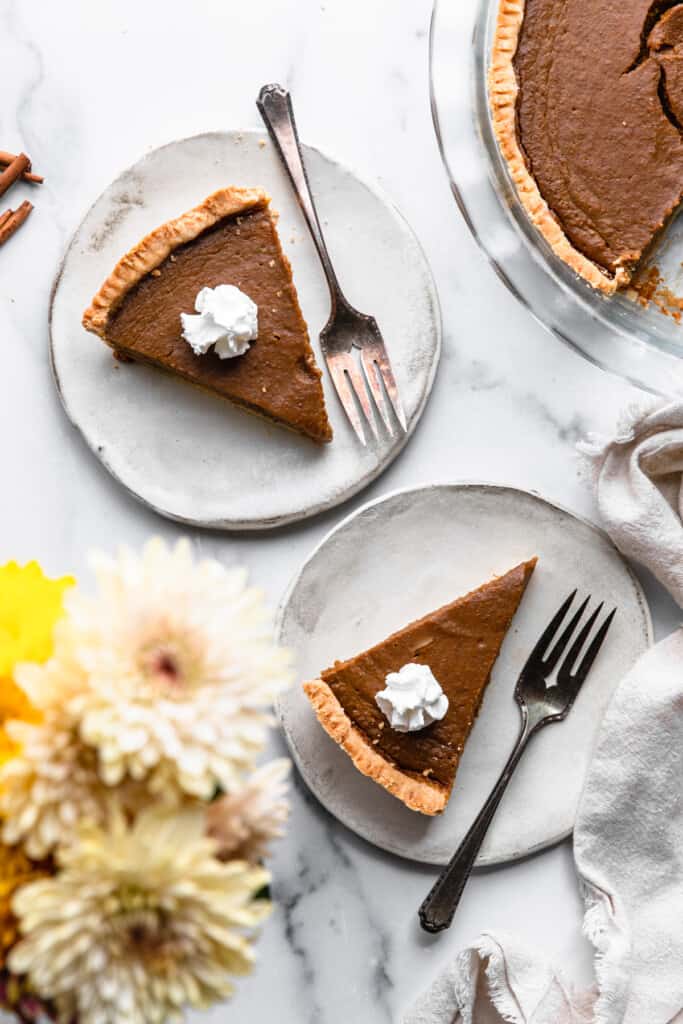 slices of Paleo Pumpkin Pie on small plates with forks