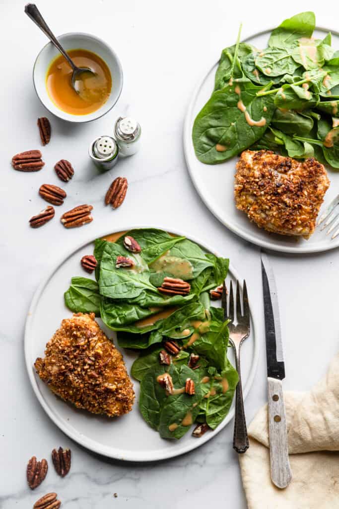 Pecan Crusted Chicken on plates with salad