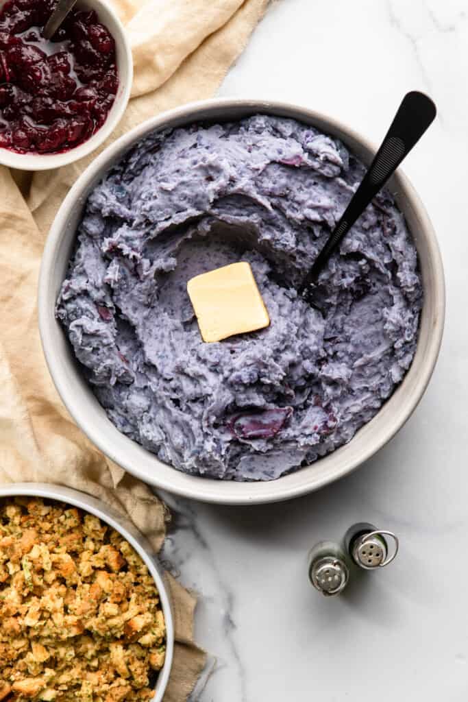 Purple Mashed Potatoes in a large serving dish