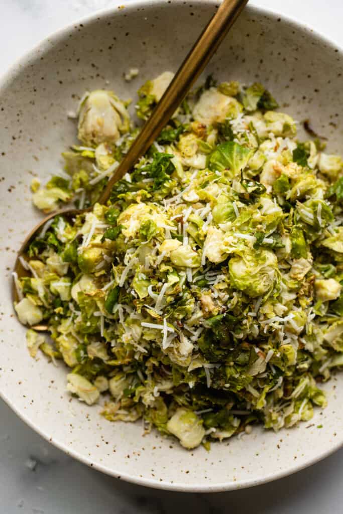 Shaved Brussels Sprouts Recipe in a bowl with a spoon