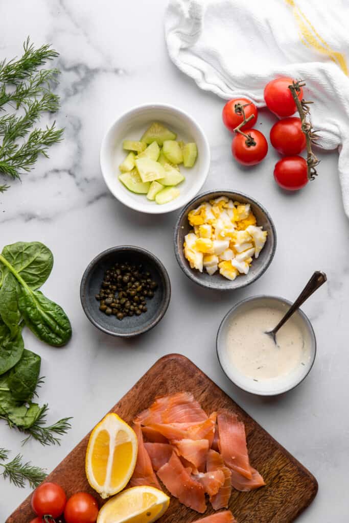 ingredients in small bowls for Smoked Salmon Salad