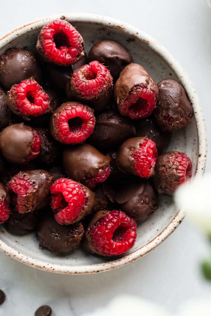 Chocolate Covered Raspberries in a bowl on a table