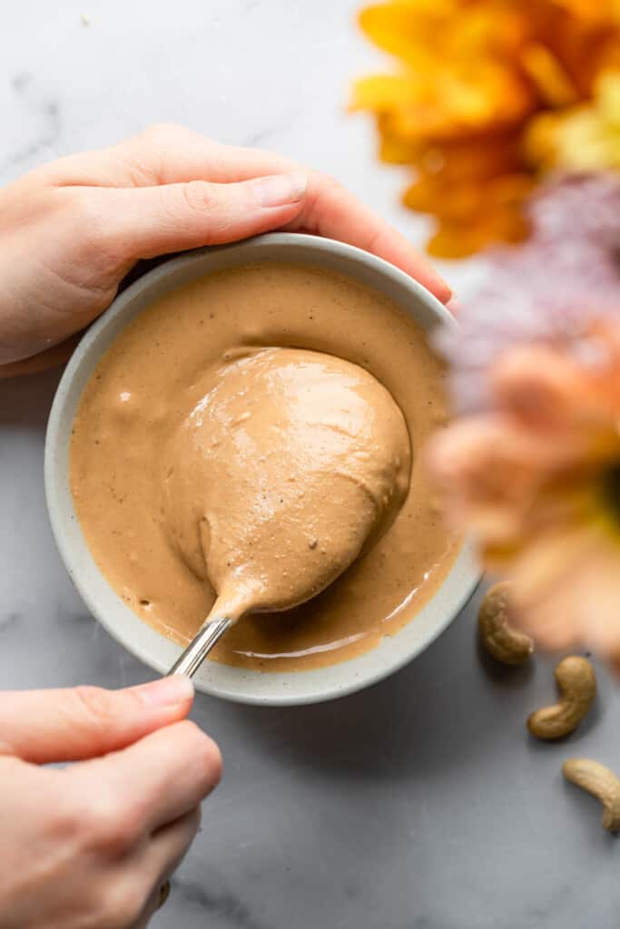 a spoon in a bowl of Cashew Butter
