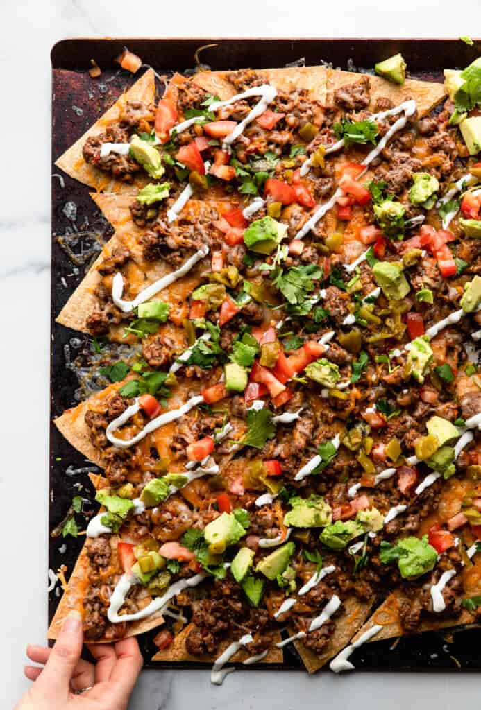 Healthy Nachos on a sheet with toppings