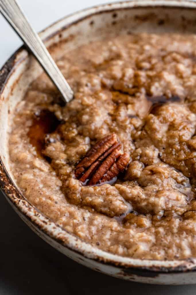 a bowl of Maple Brown Sugar Oatmeal with a spoon in it