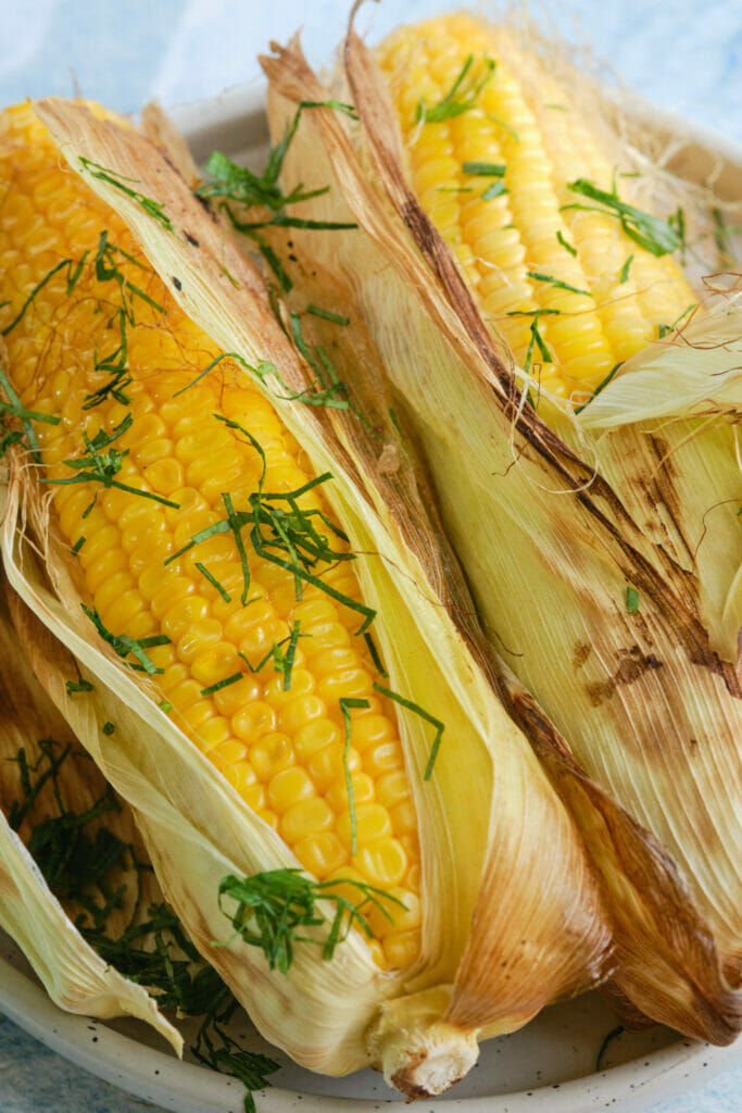 Grilled corn in the husk